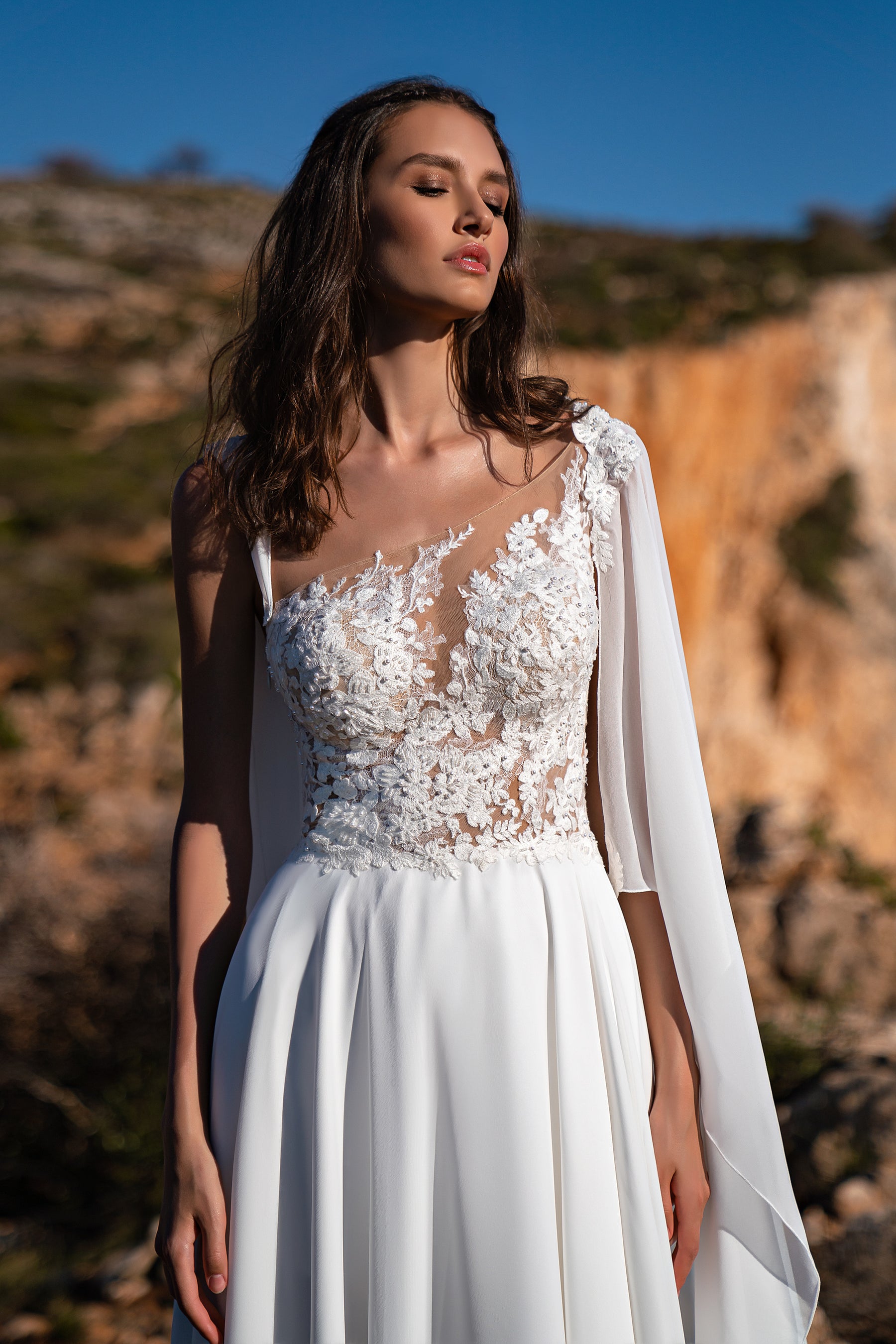 Exquisite Wedding Dress with Asymmetrical Corset, Soft Skirt, and Multi-Chiffon Train, Decorated with Floral Chantelle Appliques, Beads, Pearls, and Sequins, with Removable Element