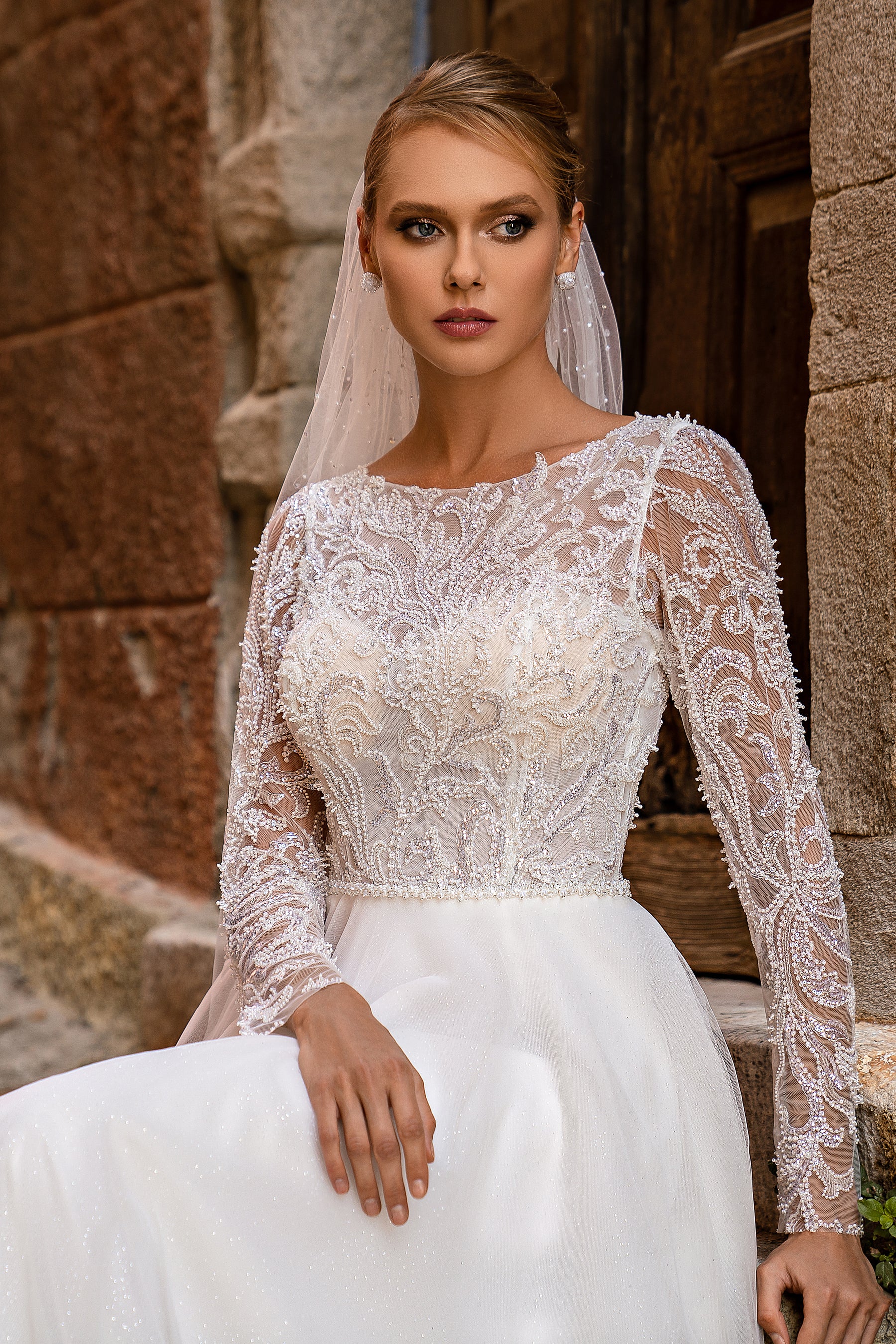 Romantic "A" Silhouette Wedding Dress with Long Sleeves, Glittering Skirt, and Hand-Sewn Beaded Belt