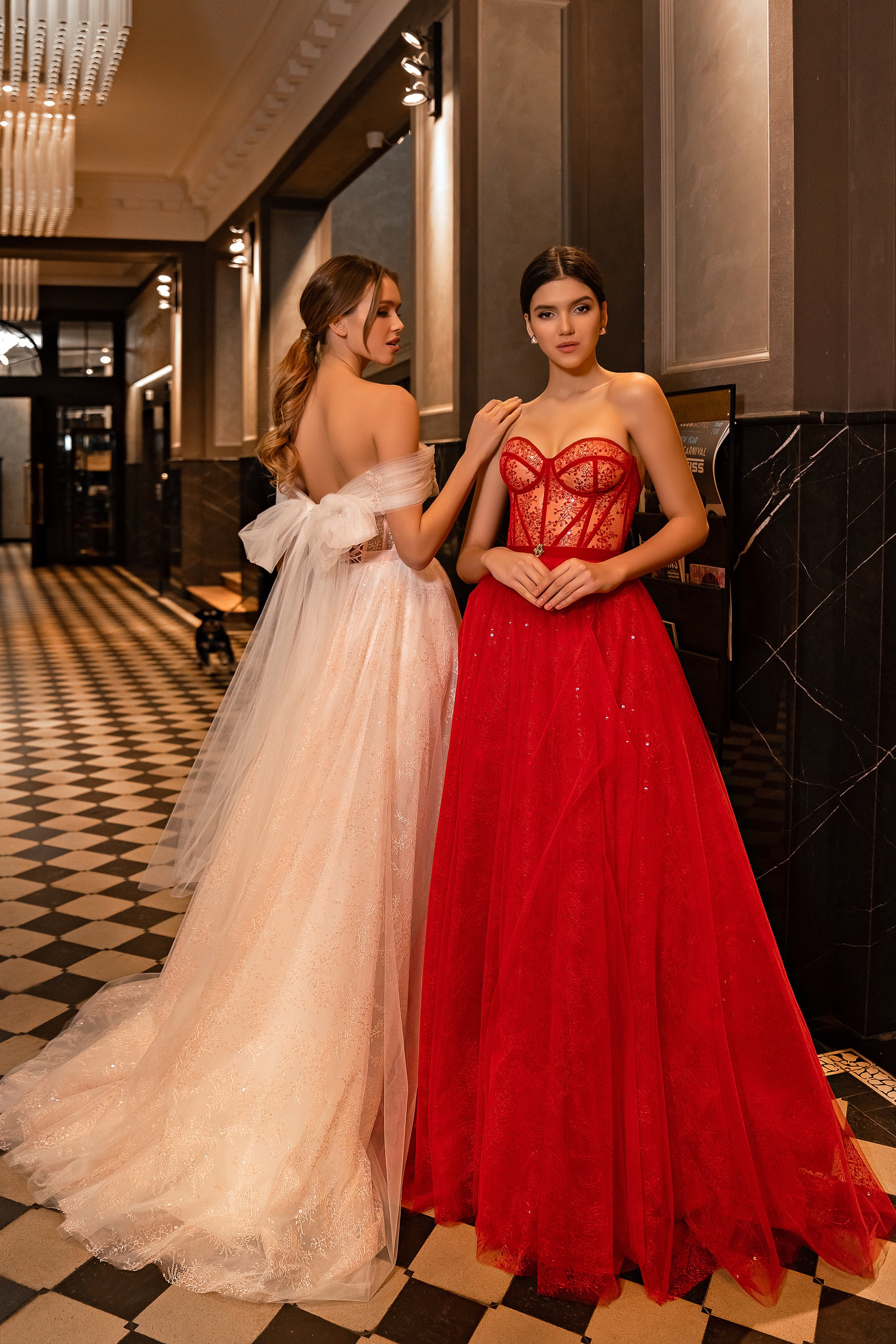 Red evening dress with a structured strapless bodice and full, sparkling tulle skirt