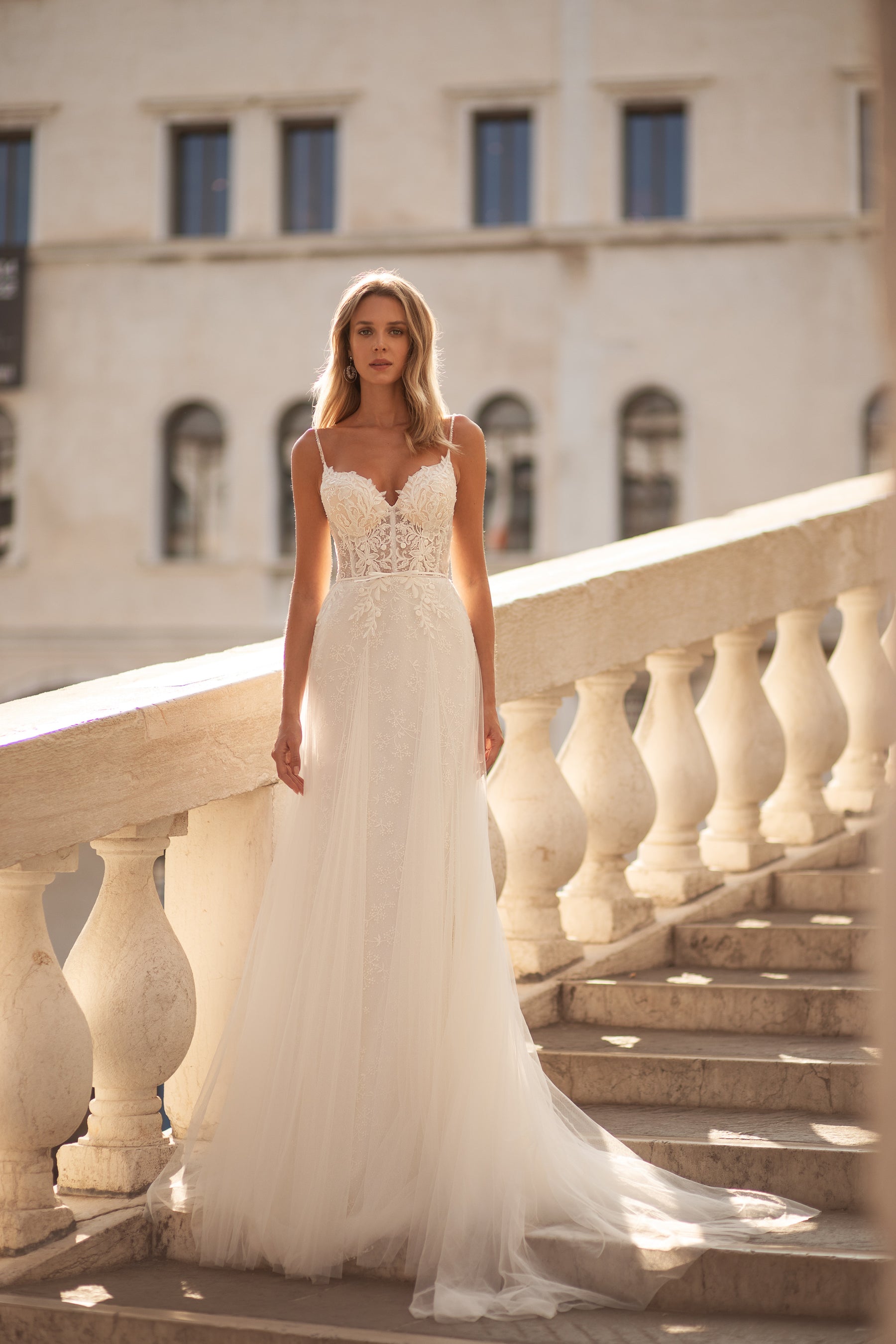 Elegant Fit-and-Flare Lace Bridal Dress with Spaghetti Straps, V-Neck, and Detachable Cape