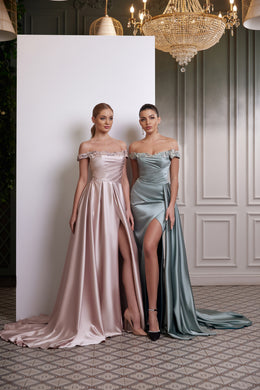 Pink and blue satin evening dresses with off-the-shoulder necklines, thigh-high slits, and long trains
