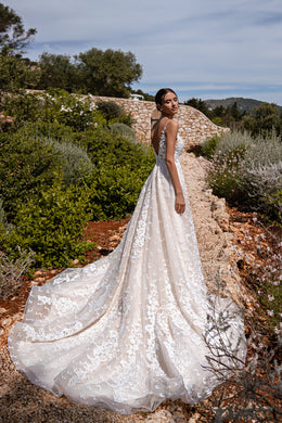 Elegant Guipure Wedding Dress with Crystals, Removable Ruffled Bolero, and Semi-Sheer Corset with Deep Cut