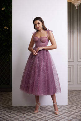 Purple sequined evening dress with a sweetheart bodice, sheer tulle straps, and a full tea-length skirt