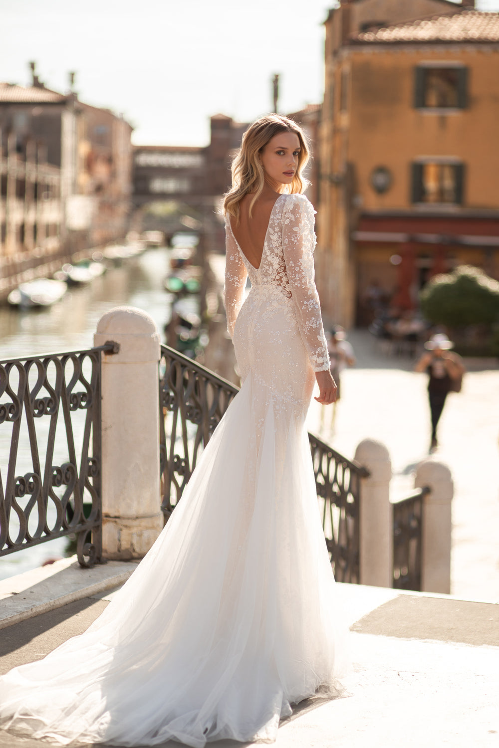 Luxurious Beaded Deep V-Neck Bridal Gown with Lace, Tulle Train, Long Sleeves, and Open Back