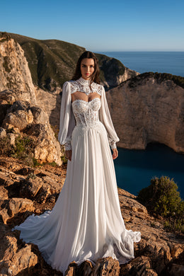 Ivory A-line wedding dress with a high lace neckline, sheer bishop sleeves, beaded bodice, and sweeping train