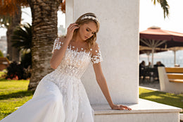 Romantic A-Line Wedding Dress with Glittery Corset, Floral Appliqués, and Train