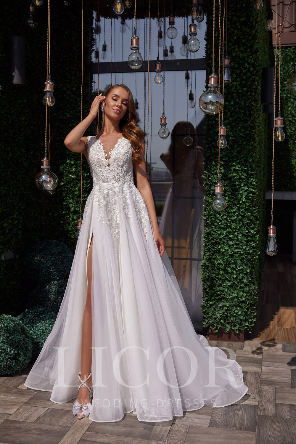 Romantic A-Line Wedding Dress with Lace Appliqués, V-Neck, Sleeveless, Tulle Skirt and Cathedral Train