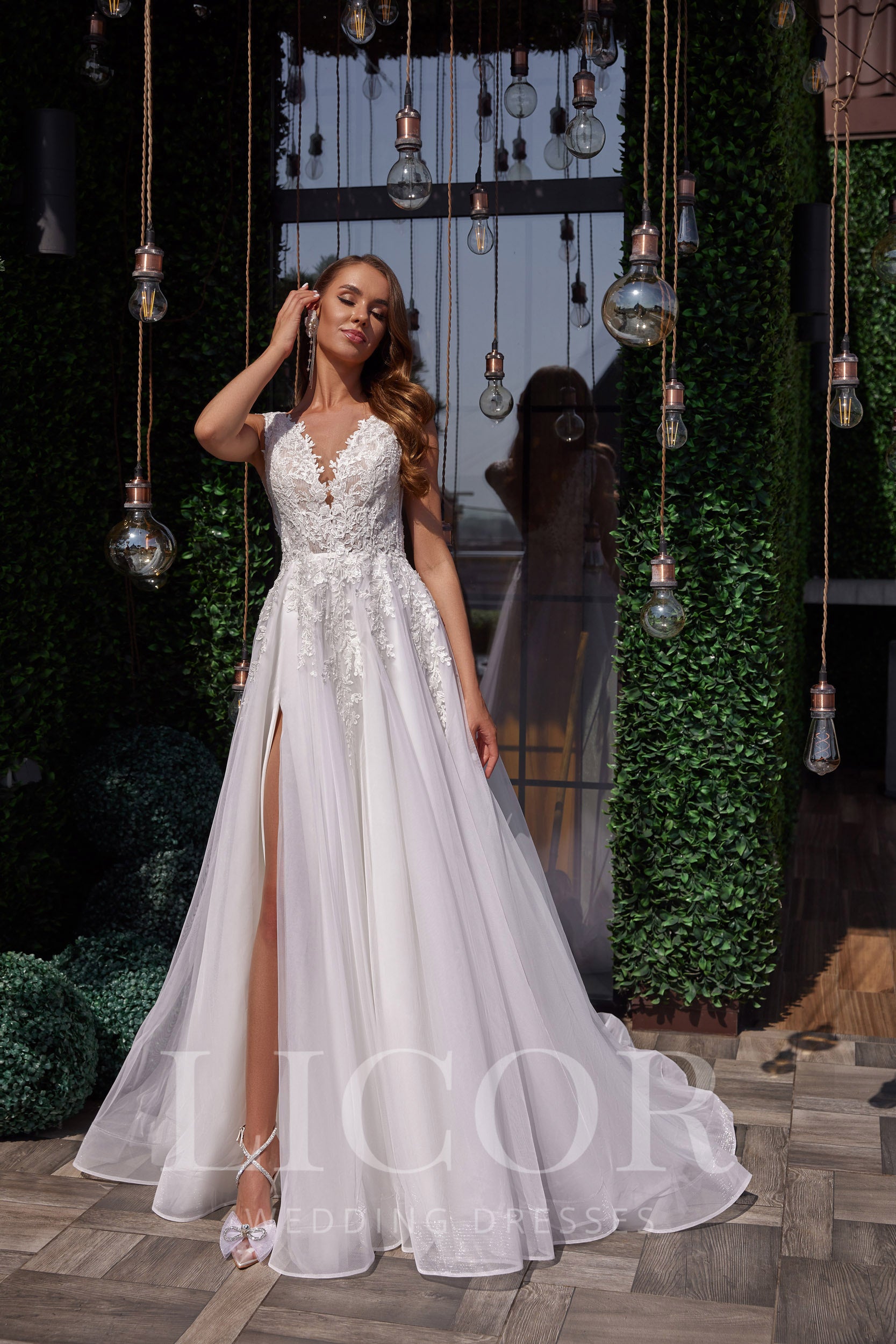 Romantic A-Line Wedding Dress with Lace Appliqués, V-Neck, Sleeveless, Tulle Skirt and Cathedral Train
