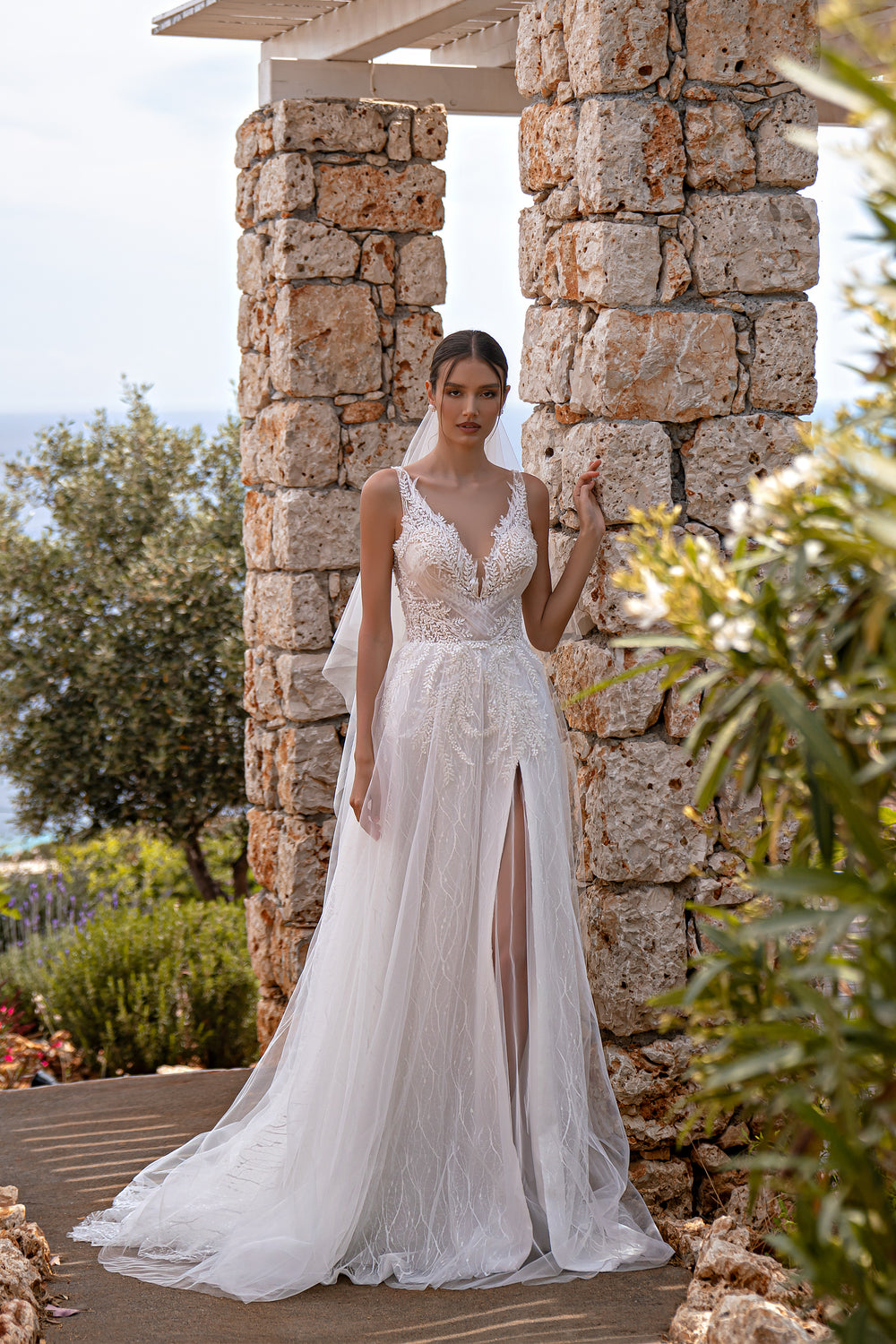 Elegant "V" Neckline Wedding Dress with Embroidered Sequins, Pearls, Beads, and Tulle Drapery