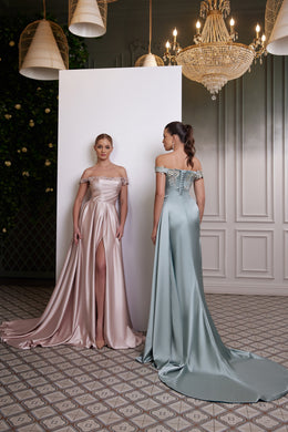 Back view of a blue satin evening dress with an off-the-shoulder neckline and long flowing train
