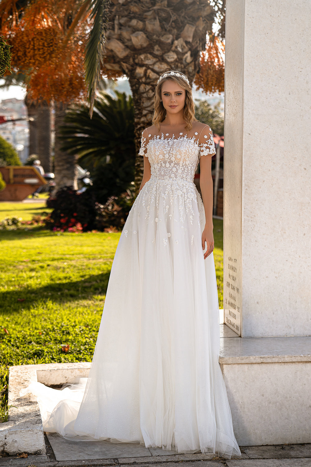 Romantic A-Line Wedding Dress with Glittery Corset, Floral Appliqués, and Train