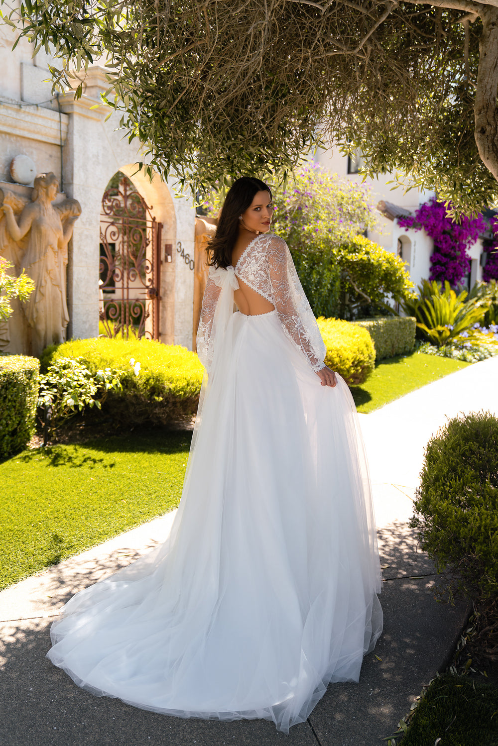 Designer Wedding Dress in Boho Style with Puffed Sleeves, Luxurious Skirt, Corset Waist, Bow, Guipure Embroidery & Sequins