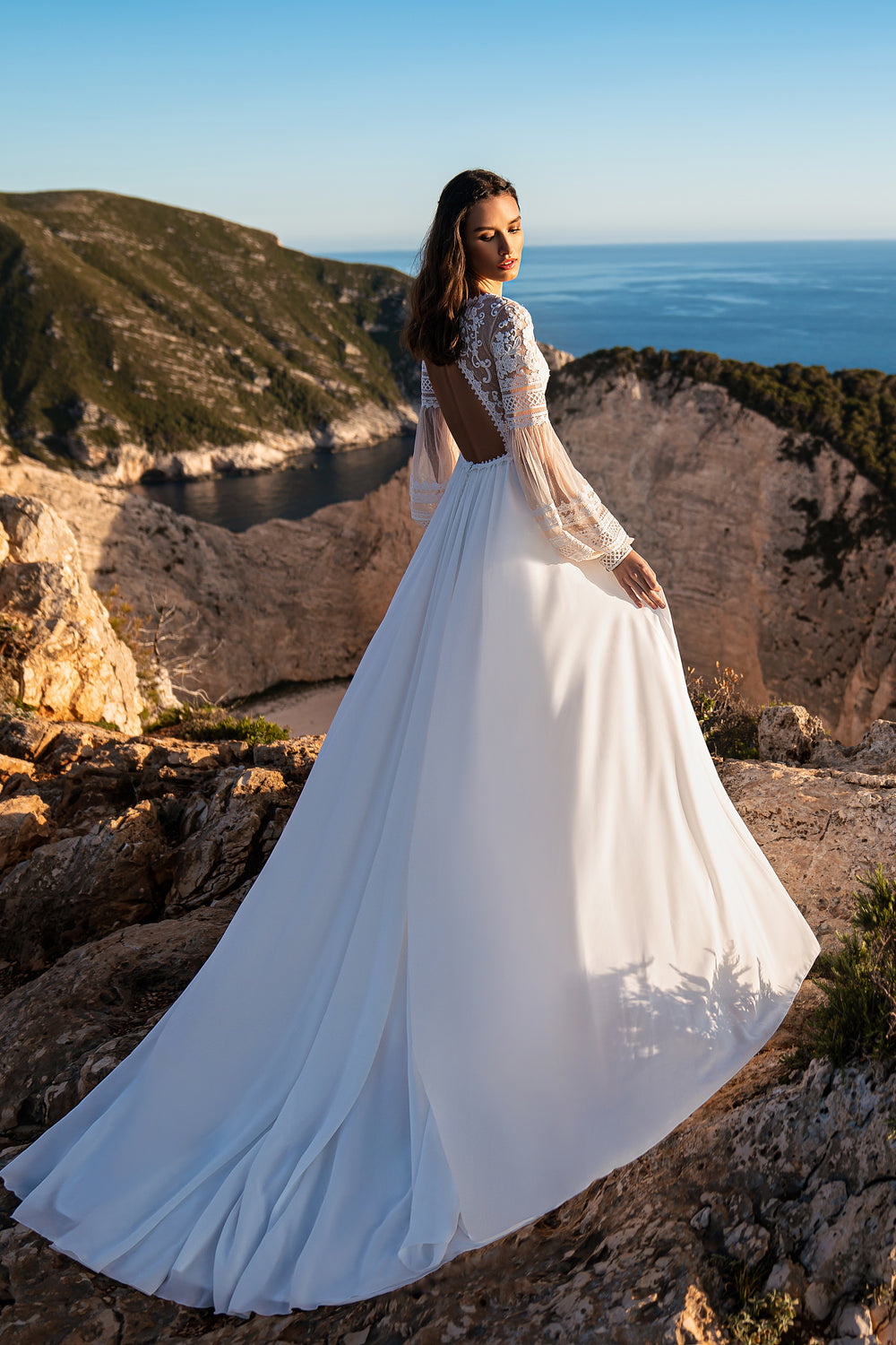 Beautiful Boho Wedding Dress with Embroidered Sequins, Lace, Long Sleeves, Corset, and Deep Cut Back