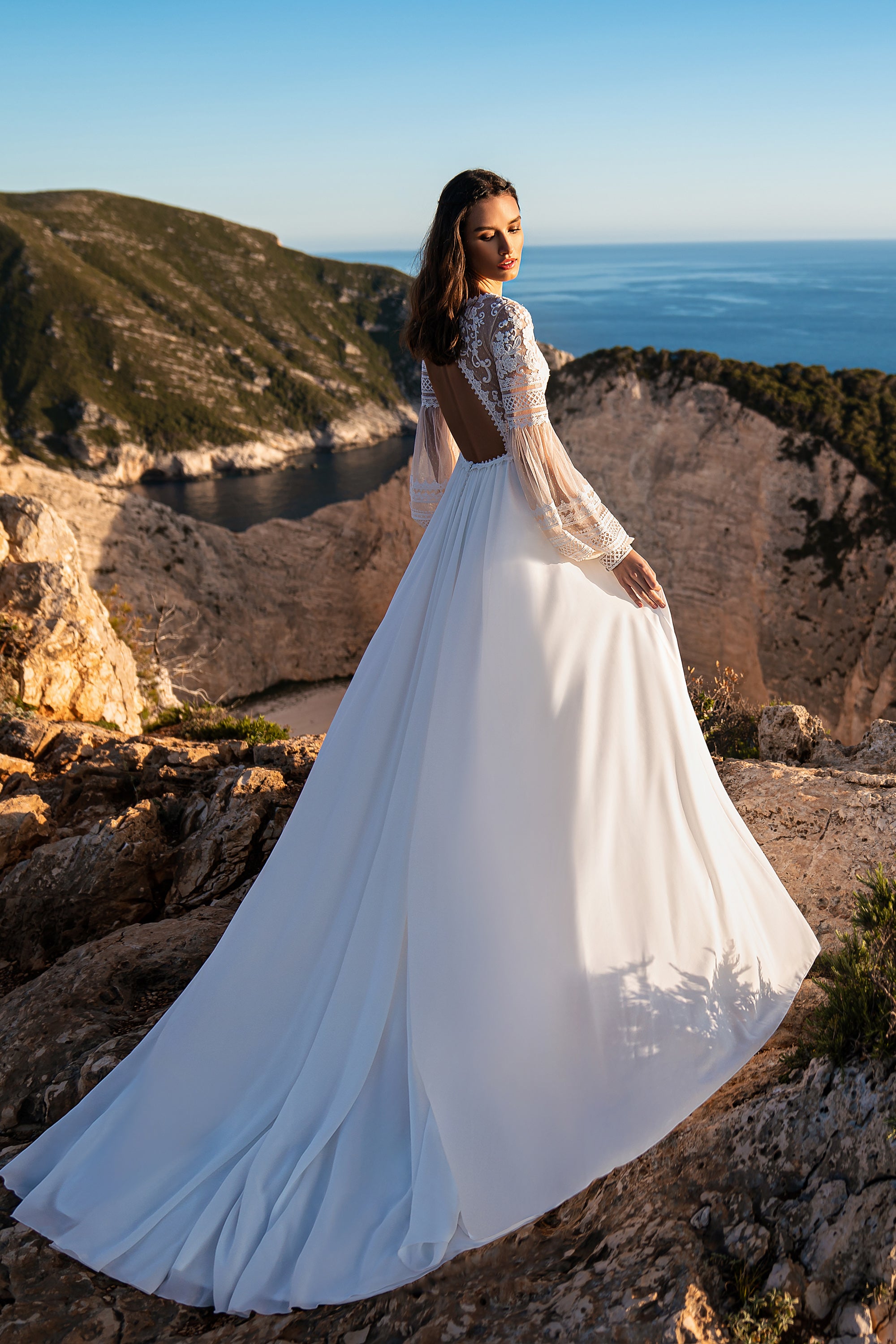 Beautiful Boho Wedding Dress with Embroidered Sequins, Lace, Long Sleeves, Corset, and Deep Cut Back