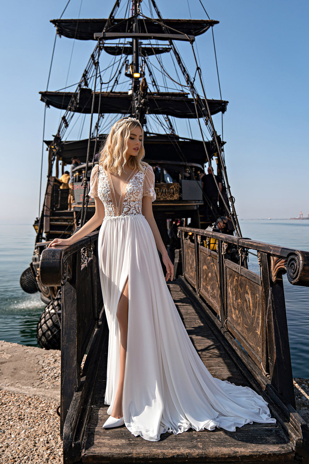 Beautiful Boho Beach Wedding Dress with V-Neck, Short Sleeves, Sheath Silhouette, Pearls and Court Train