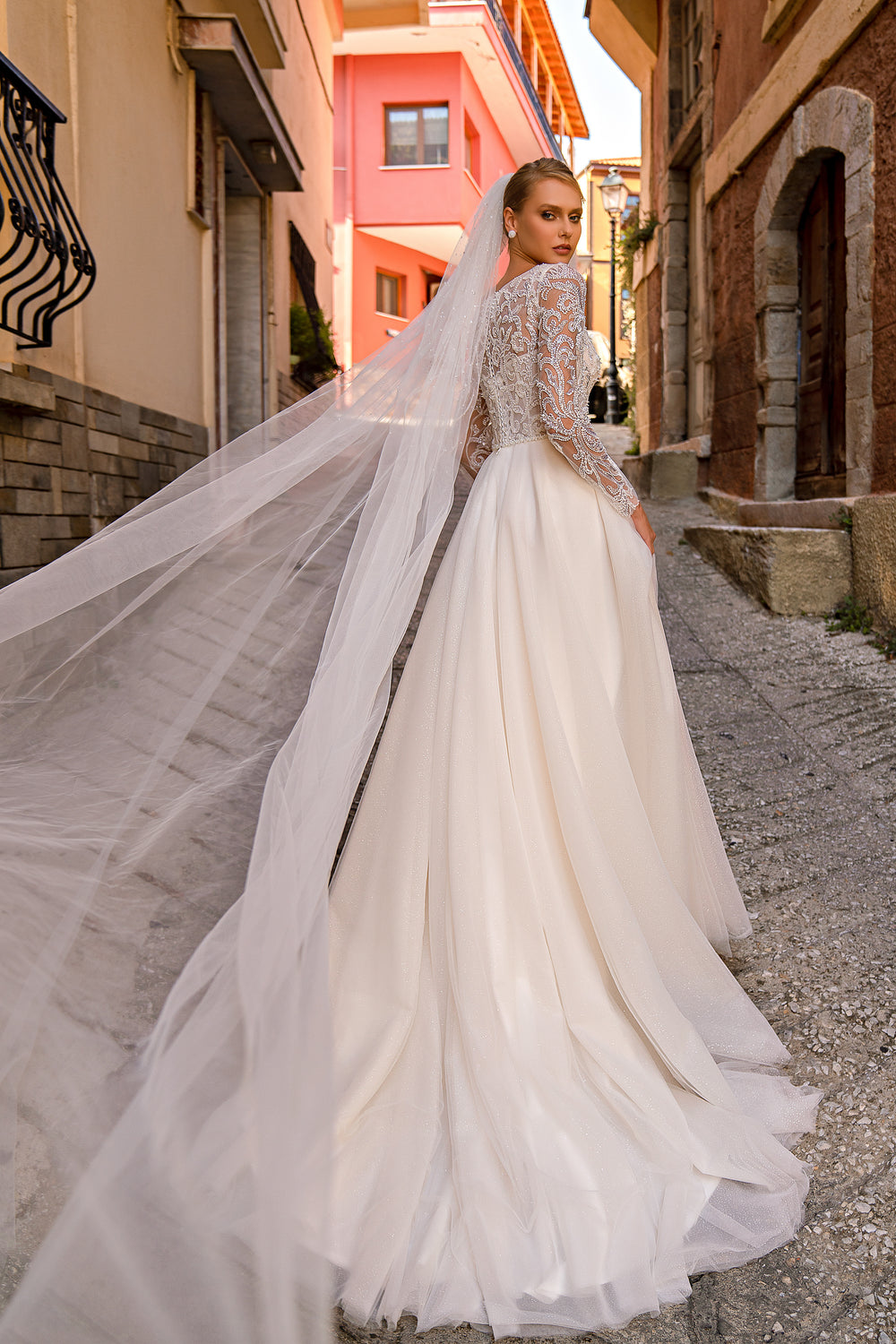 Romantic "A" Silhouette Wedding Dress with Long Sleeves, Glittering Skirt, and Hand-Sewn Beaded Belt