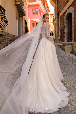 Romantic "A" Silhouette Wedding Dress with Long Sleeves, Glittering Skirt, and Hand-Sewn Beaded Belt
