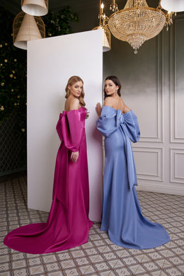 Back view of magenta and blue off-the-shoulder satin evening dresses with draped sleeves and long trains