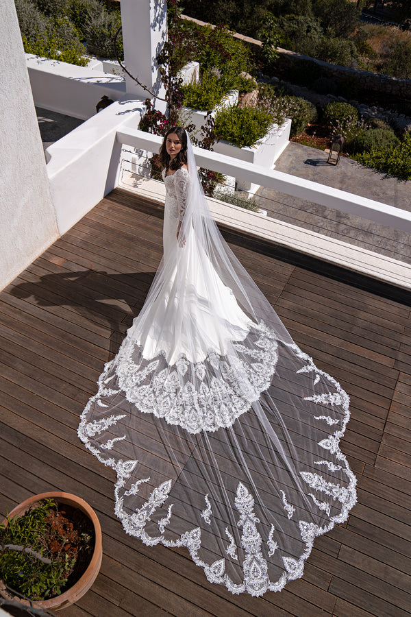 Beautiful Bridal Gown with Long Decorated Train, Detachable Puffy Sleeves, Semi-Sheer Deep Cut Front & V-Shaped Back, Stretch Crepe Skirt with Reliefs