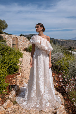Elegant Guipure Wedding Dress with Crystals, Removable Ruffled Bolero, and Semi-Sheer Corset with Deep Cut