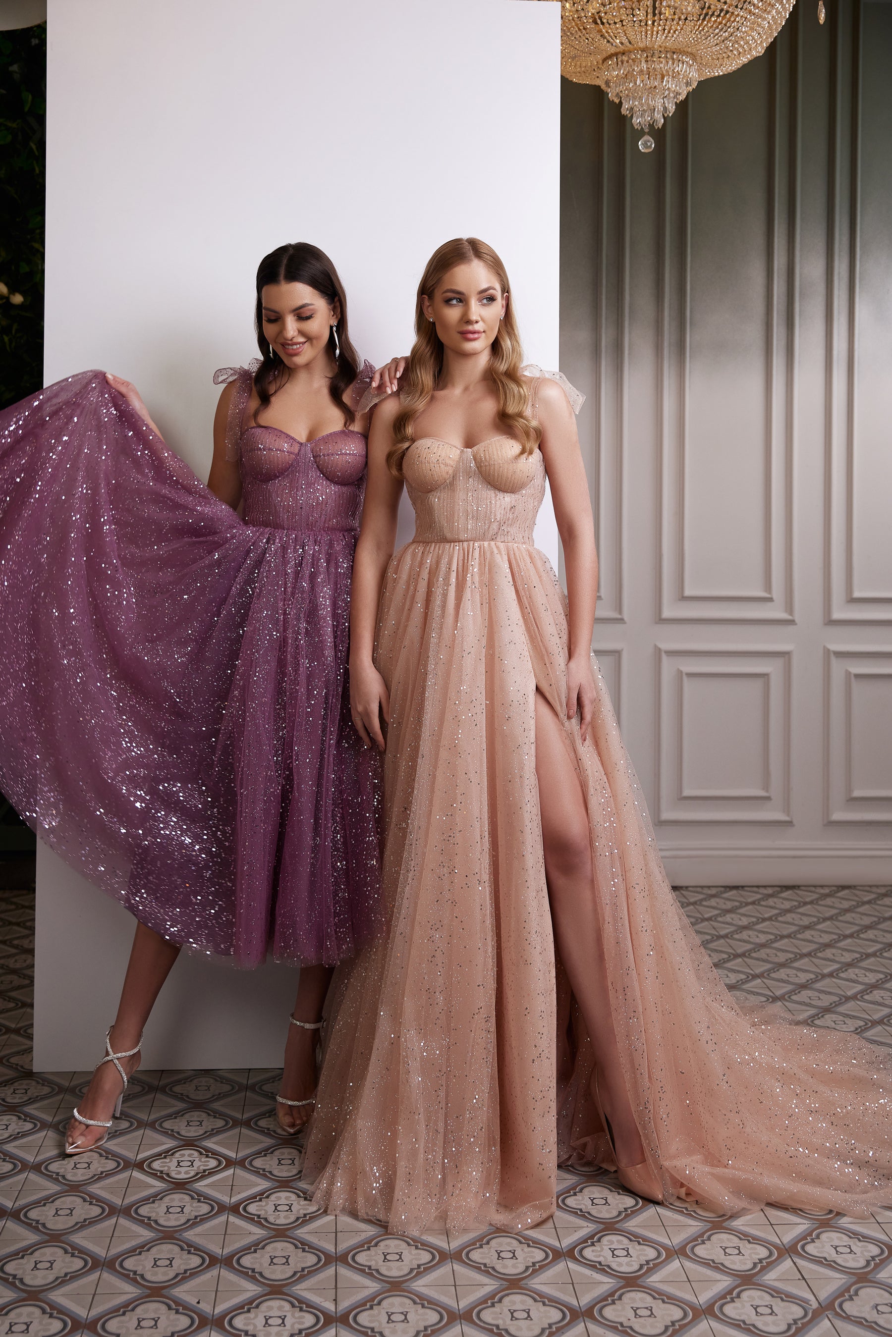 Purple glitter evening dress with a sweetheart bodice, sheer straps, and a full tea-length skirt