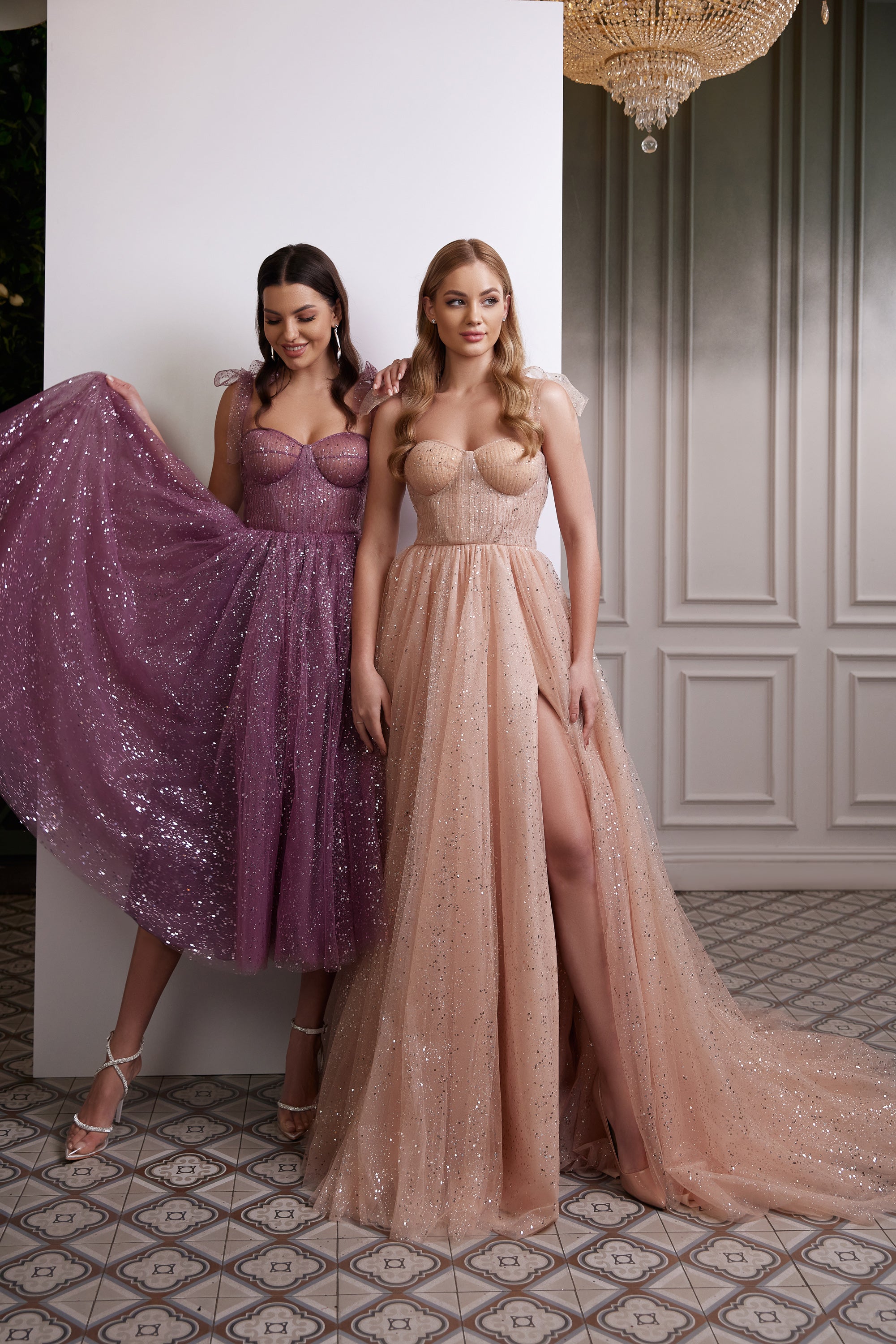 Purple glitter evening dress with a sweetheart bodice, sheer straps, and a full tea-length skirt