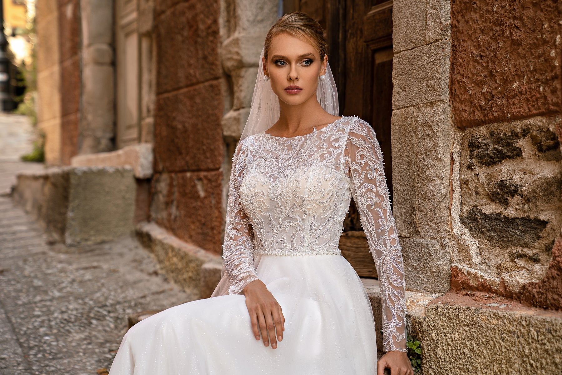 Romantic "A" Silhouette Wedding Dress with Long Sleeves, Glittering Skirt, and Hand-Sewn Beaded Belt