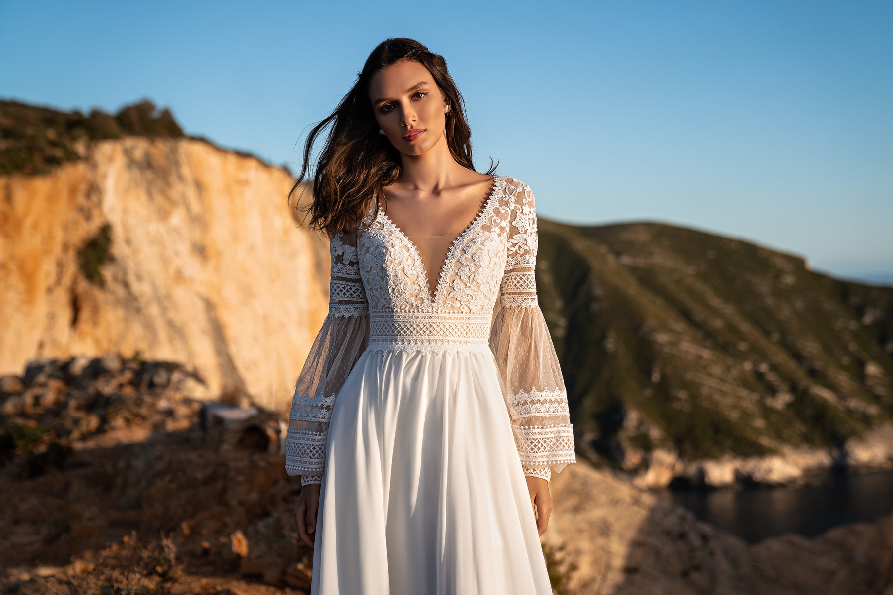 Beautiful Boho Wedding Dress with Embroidered Sequins, Lace, Long Sleeves, Corset, and Deep Cut Back