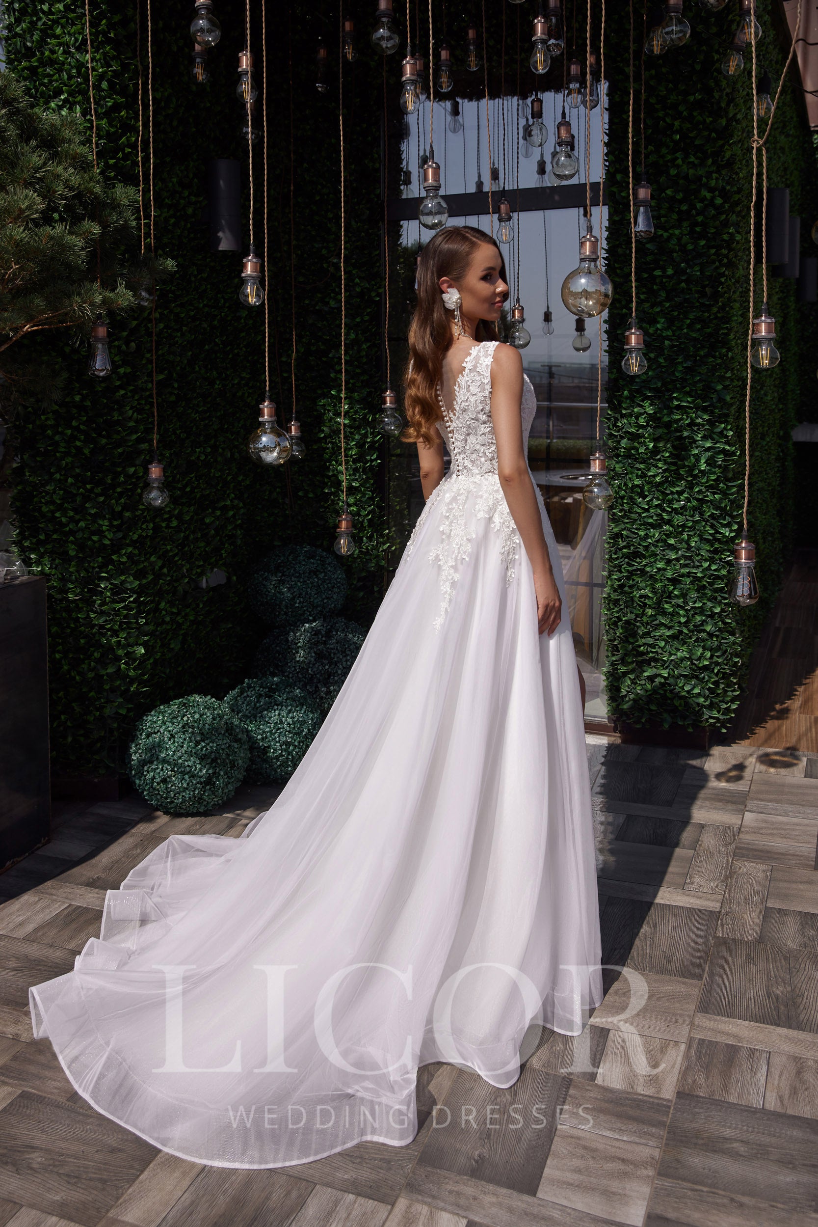 Romantic A-Line Wedding Dress with Lace Appliqués, V-Neck, Sleeveless, Tulle Skirt and Cathedral Train