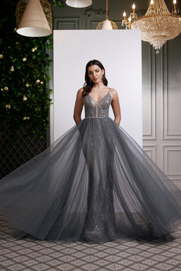 Silver-gray evening dress with spaghetti straps, plunging V-neck, beaded bodice, and glittering full skirt