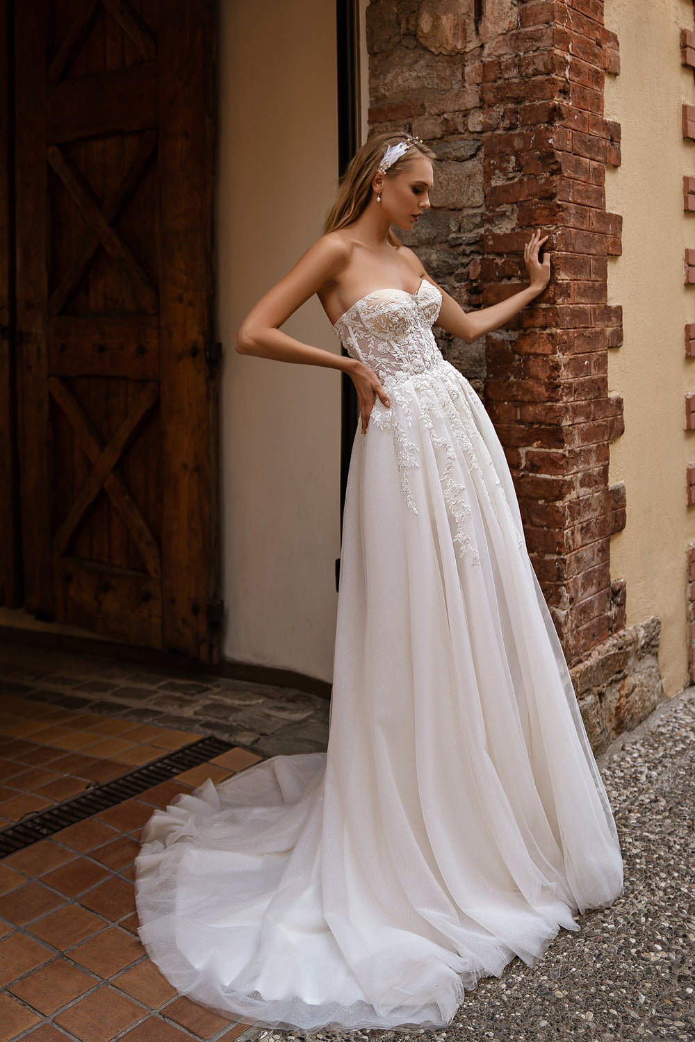 Modern Off-the-Shoulder Wedding Dress with Embroidered Floral Appliqués, Glitter Layers, and Lacing at the Back