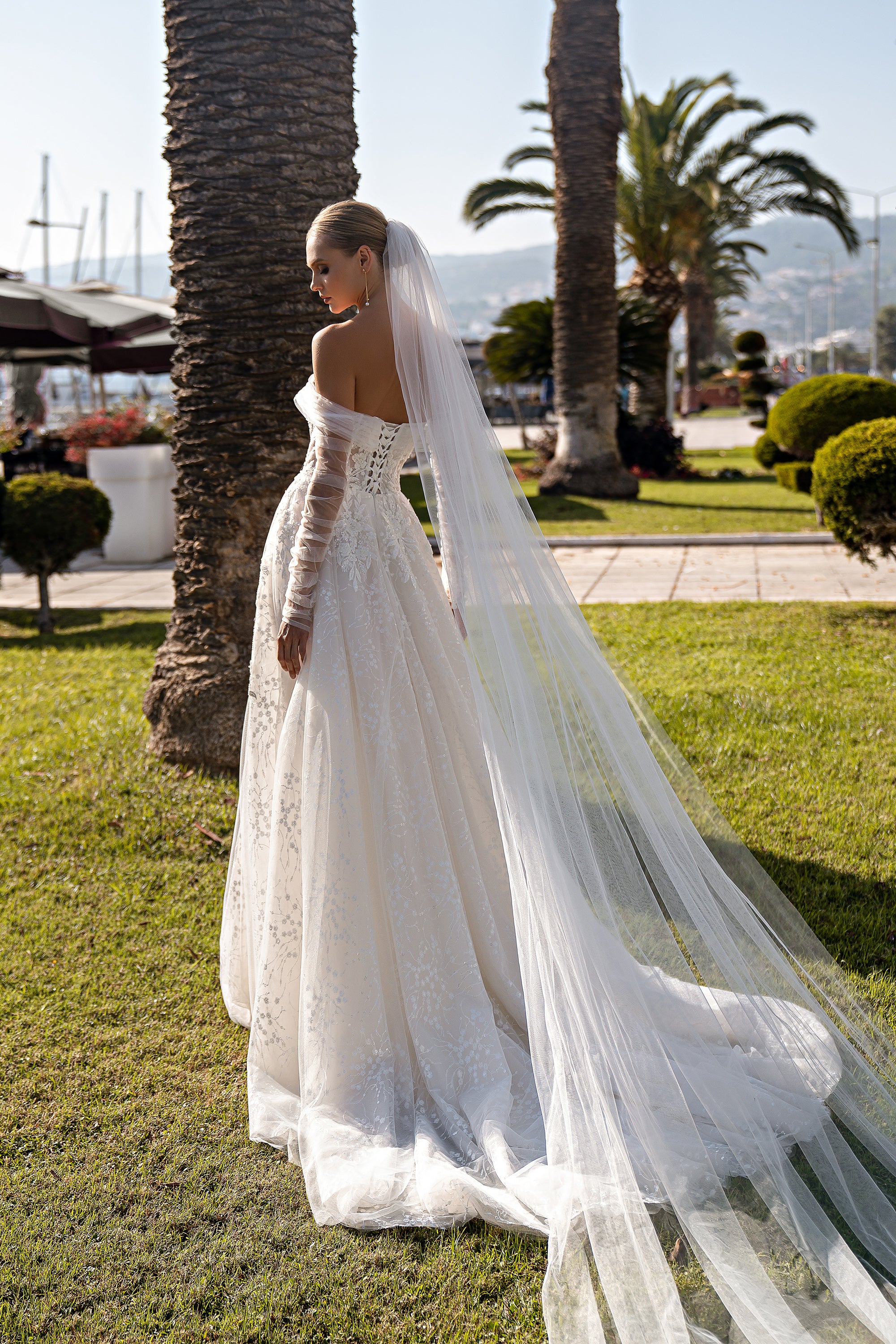 Luxurious Off-the-Shoulder Wedding Dress with Detachable Draped Sleeves and V-Neckline - Embroidered Guipure with Sequins and Soft Tulle Bodice with Beaded Appliqués