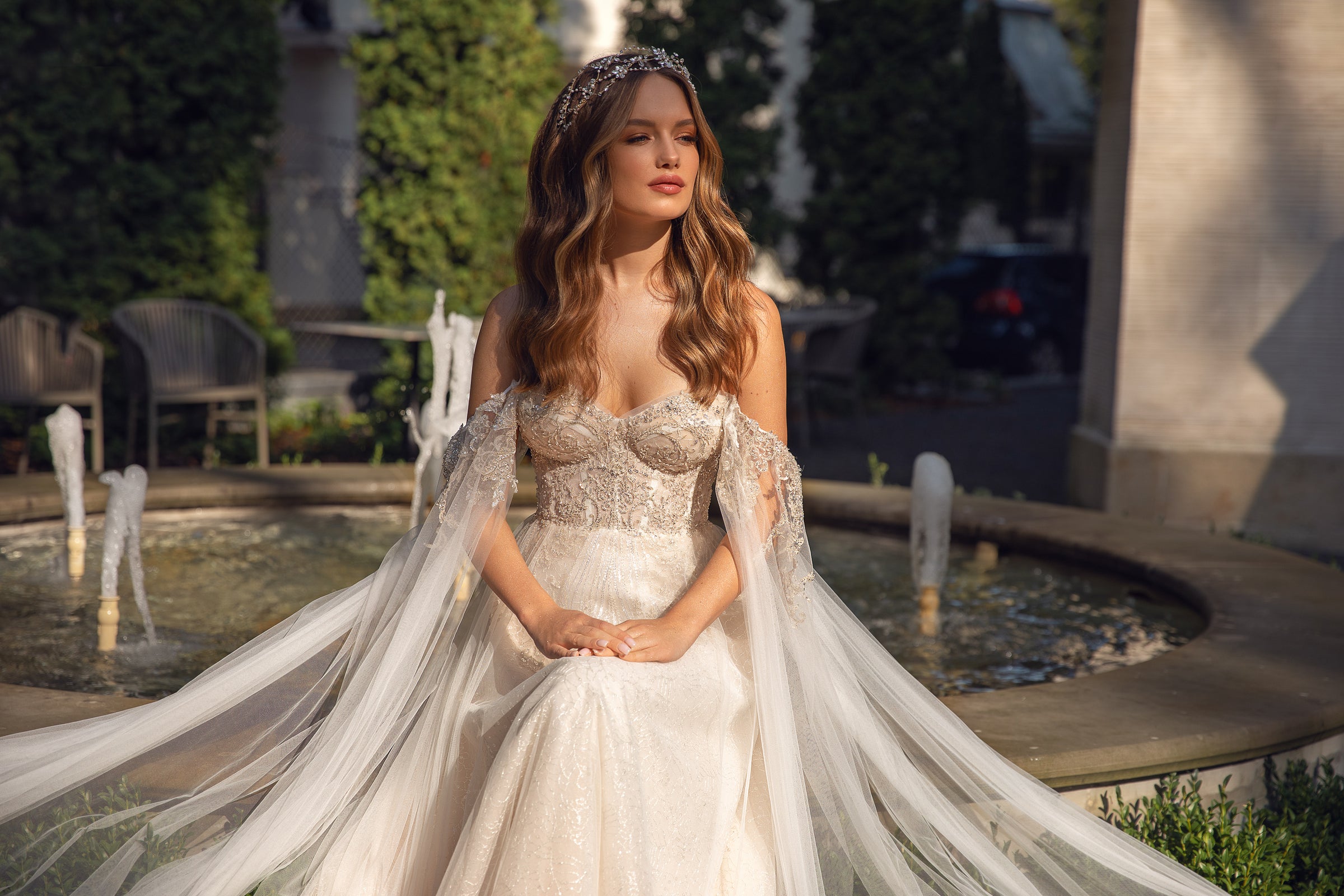 Elegant Wedding Dress with Sweetheart Neckline, Open Back, and Tulle Wing Detail