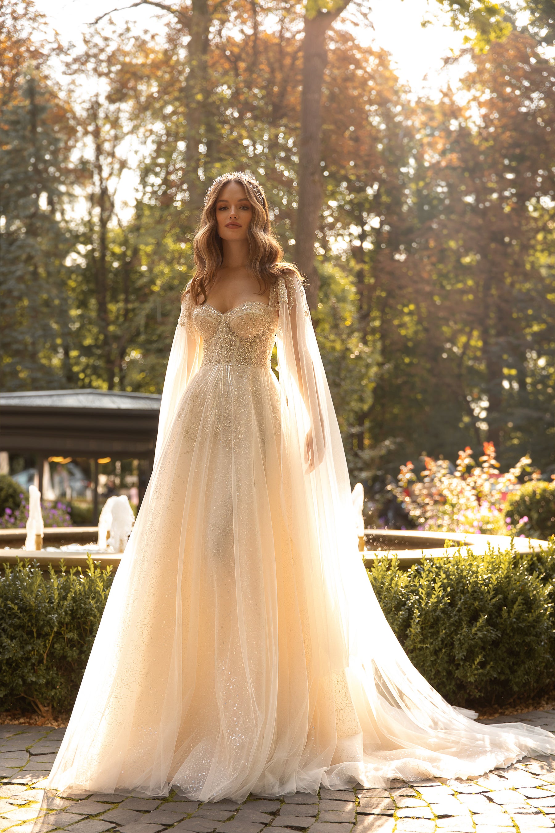 Elegant Wedding Dress with Sweetheart Neckline, Open Back, and Tulle Wing Detail