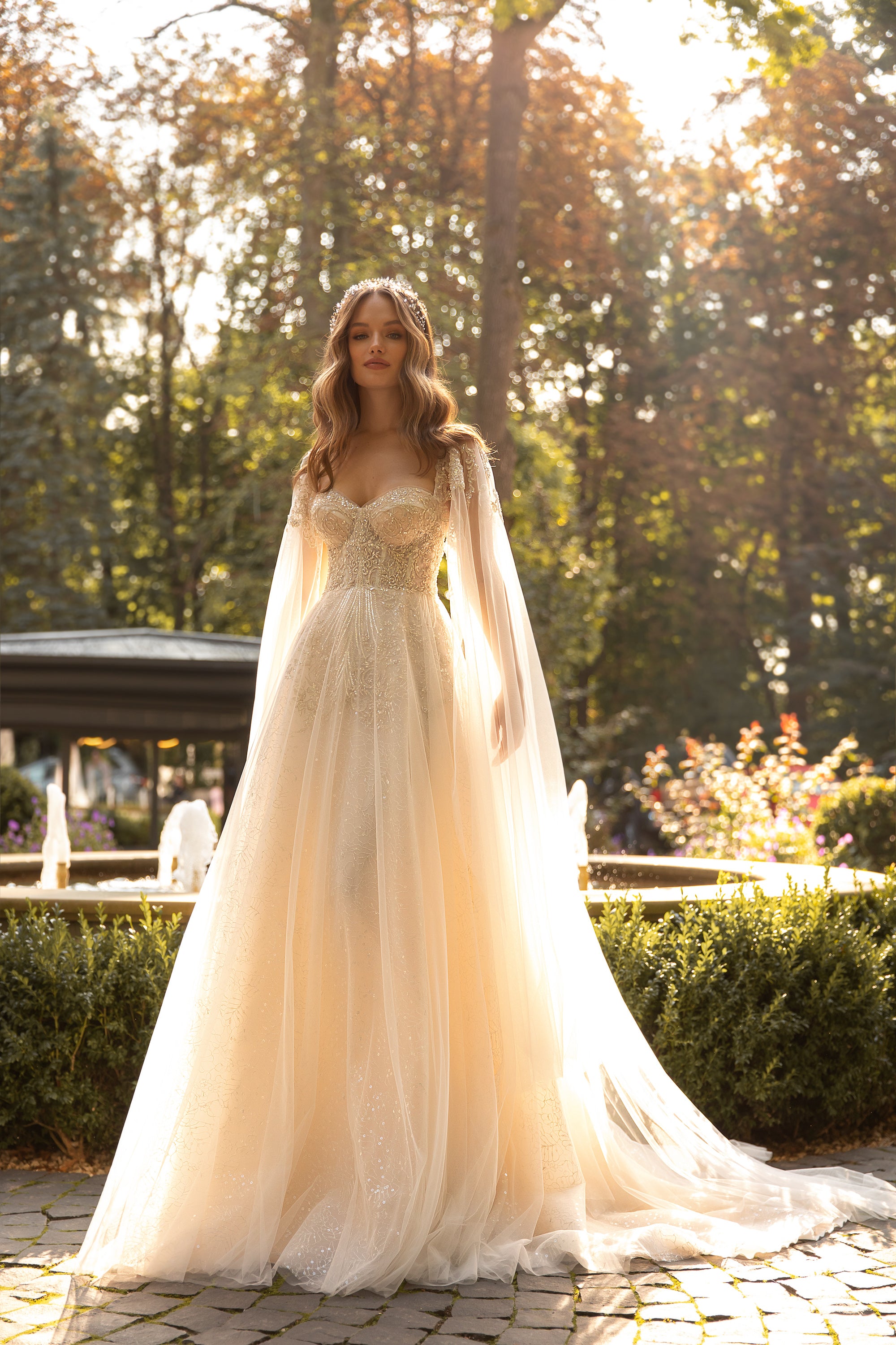 Elegant Wedding Dress with Sweetheart Neckline, Open Back, and Tulle Wing Detail