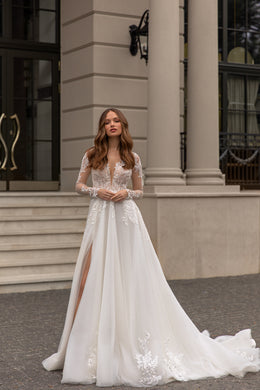 Ivory A-line wedding dress with plunging V-neck, sheer lace sleeves, floral appliqués, and a long train