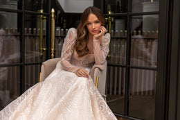 Elegant Wedding Gown with Boat Neckline, A-Line Silhouette, and Long Sleeves