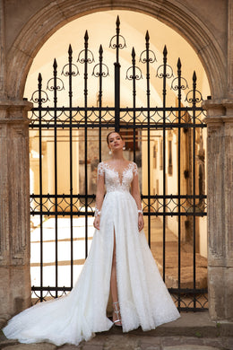 Elegant A-Line Wedding Gown with Slit Skirt, Lace, Buttons Back, and Long Sleeve Lace