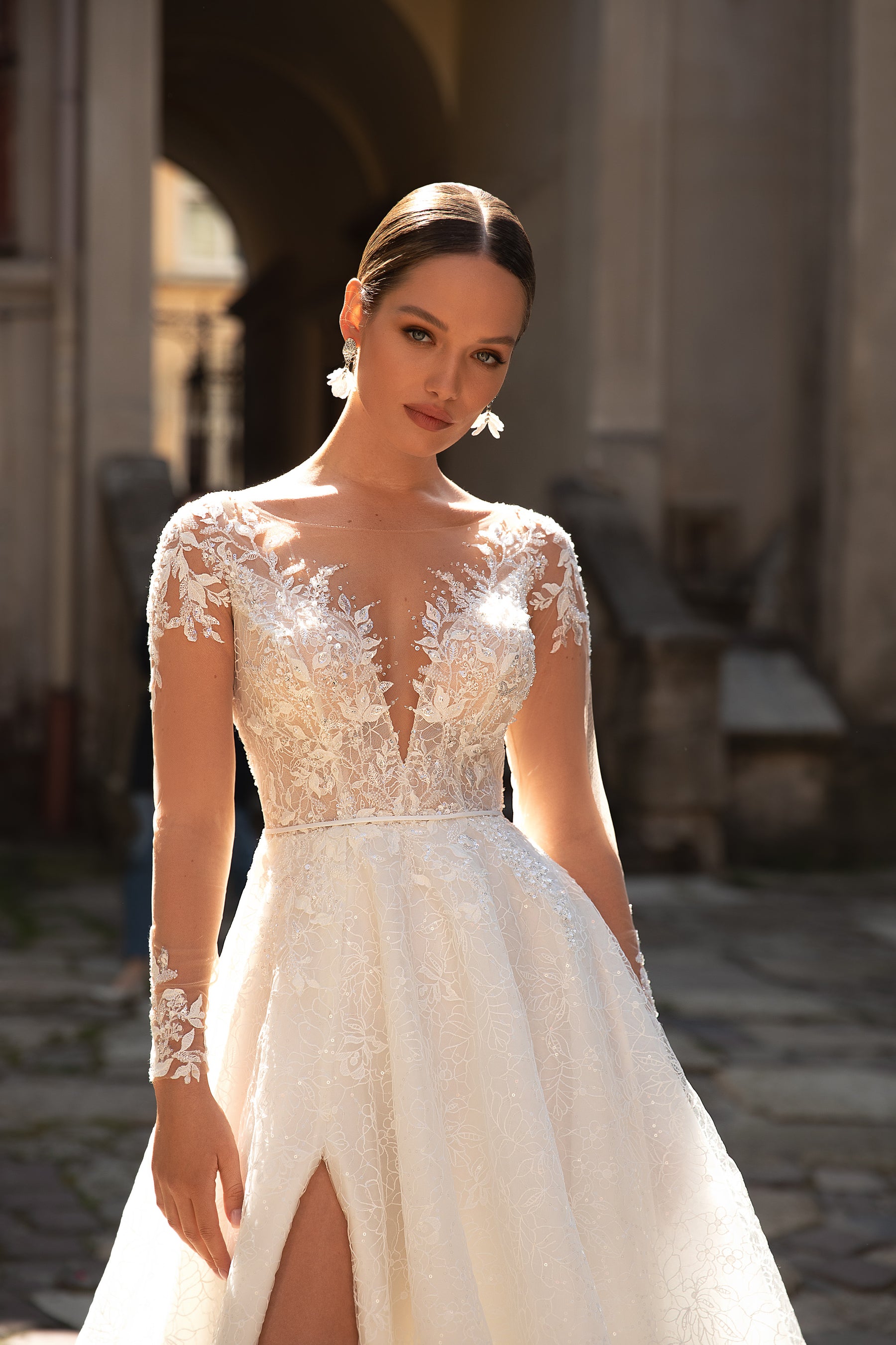 Elegant A-Line Wedding Gown with Slit Skirt, Lace, Buttons Back, and Long Sleeve Lace