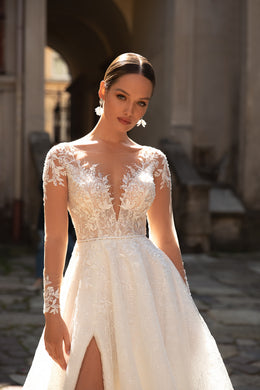 Elegant A-Line Wedding Gown with Slit Skirt, Lace, Buttons Back, and Long Sleeve Lace