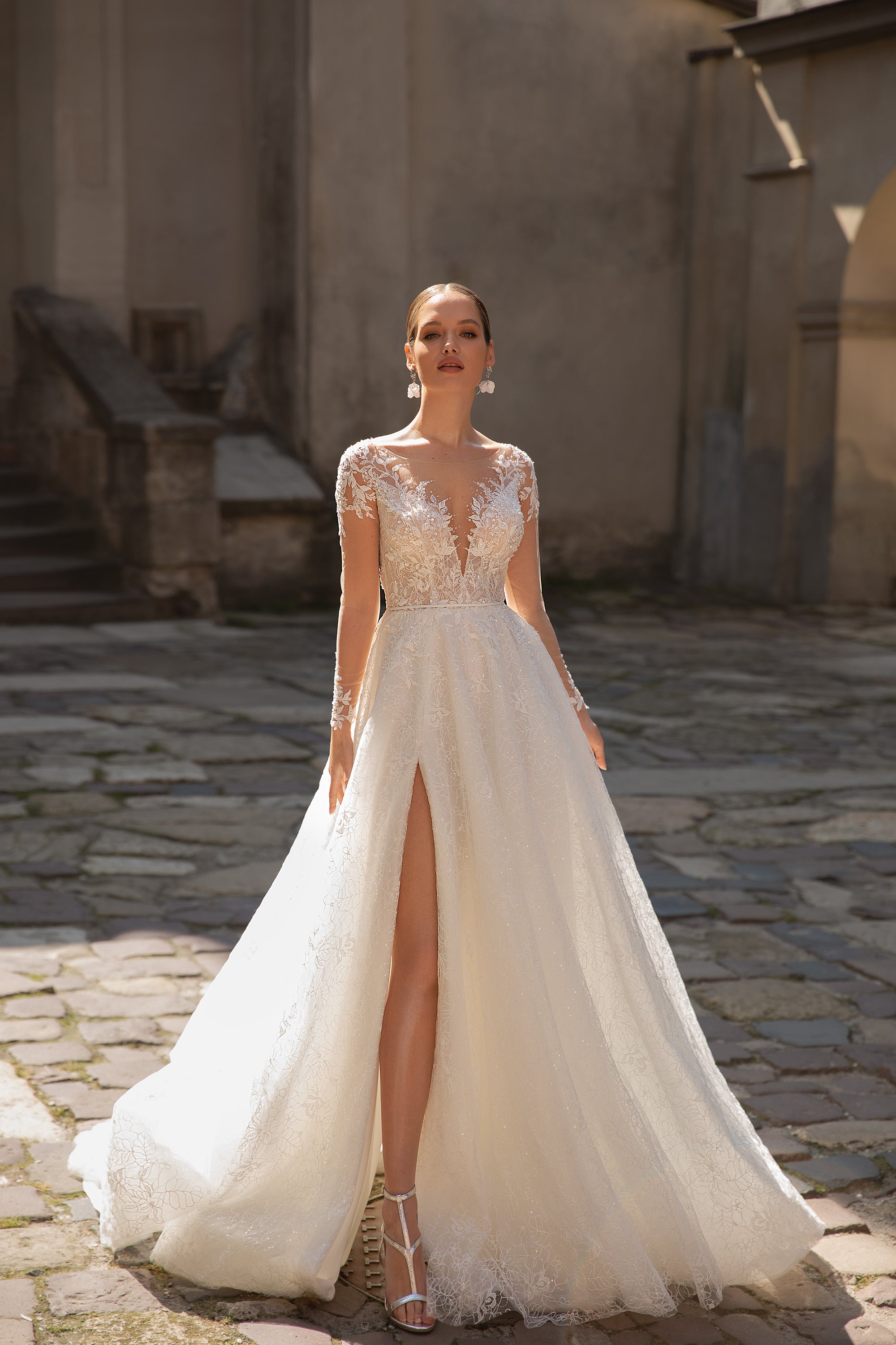 Elegant A-Line Wedding Gown with Slit Skirt, Lace, Buttons Back, and Long Sleeve Lace