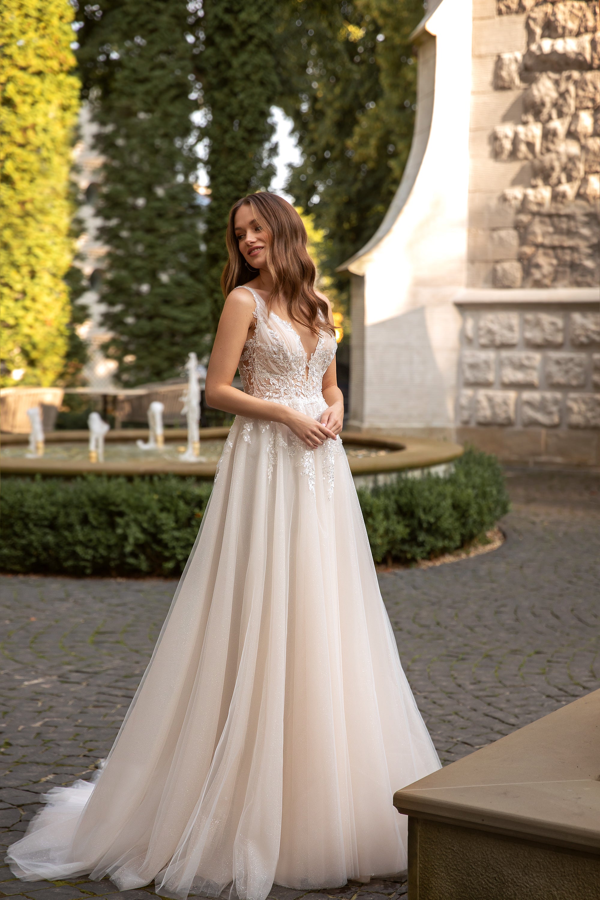 A-Line Bridal Gown with V-Neck, Beaded Lace Top, Zipper Back, and Court Train in Tulle