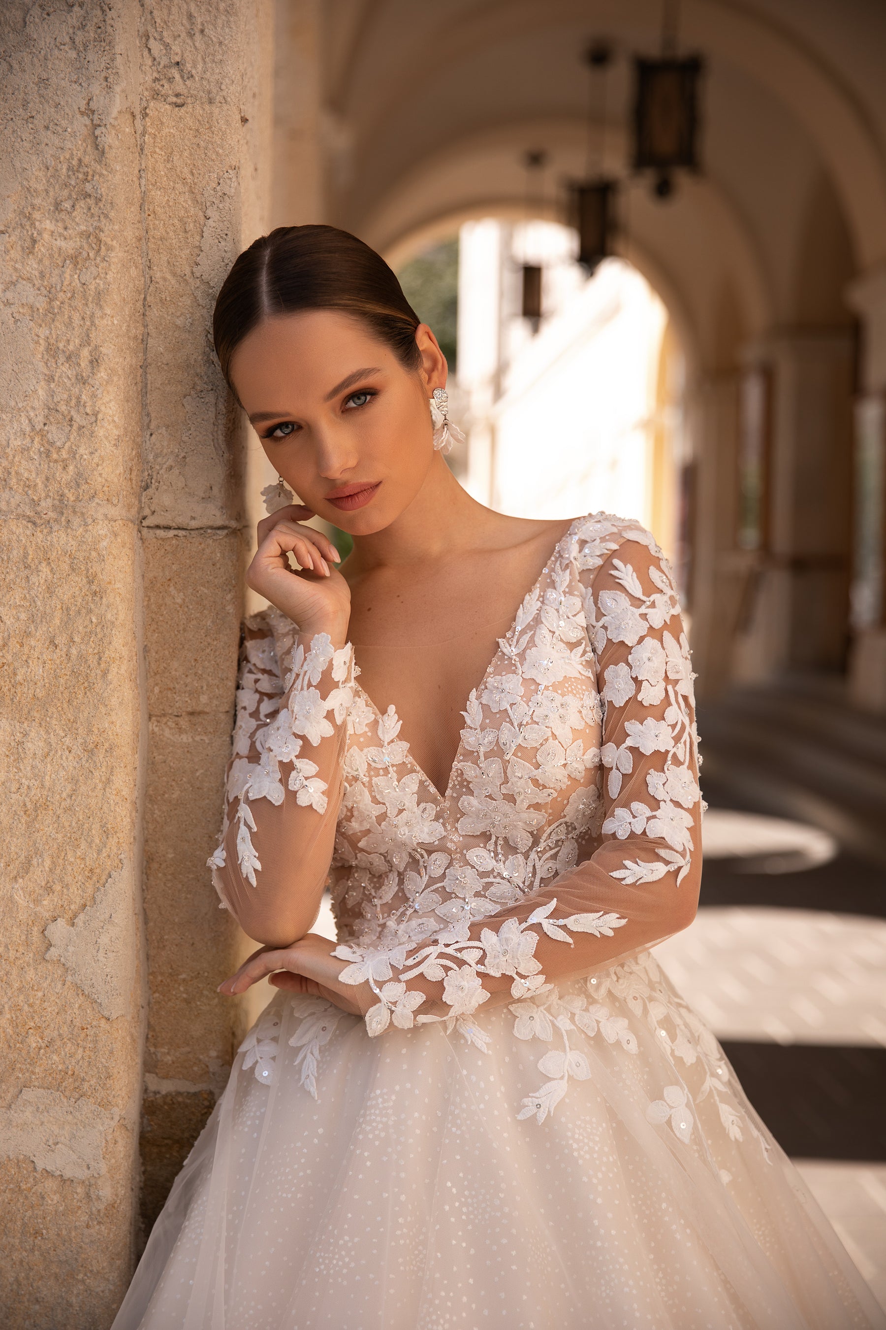 Elegant Wedding Gown with Deep V-Neck, Ballgown Silhouette, Lace Top, Tulle Skirt, and Long Lace Sleeves