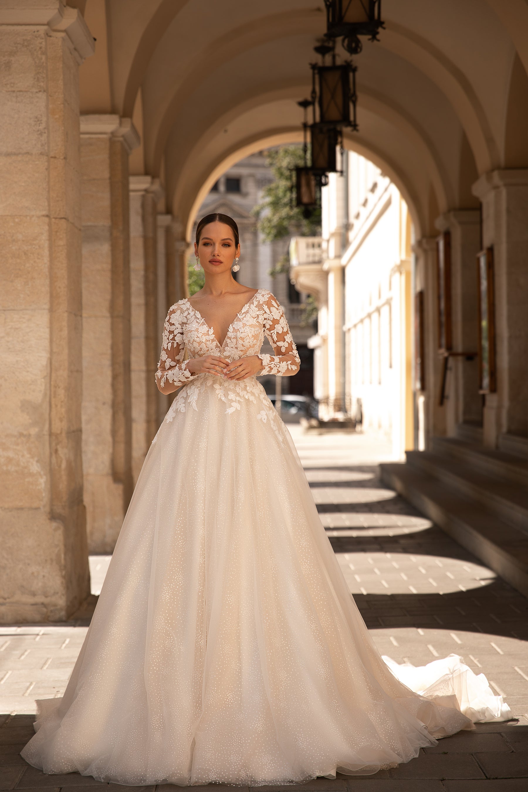 Elegant Wedding Gown with Deep V-Neck, Ballgown Silhouette, Lace Top, Tulle Skirt, and Long Lace Sleeves